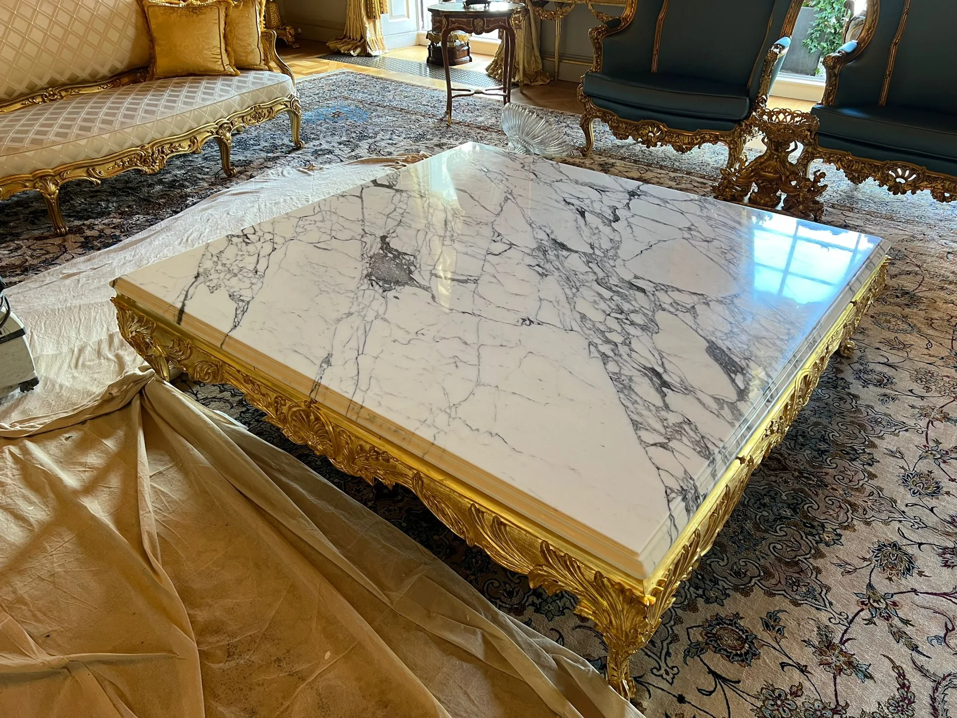 Square veined stone coffee table with a gold-coloured base